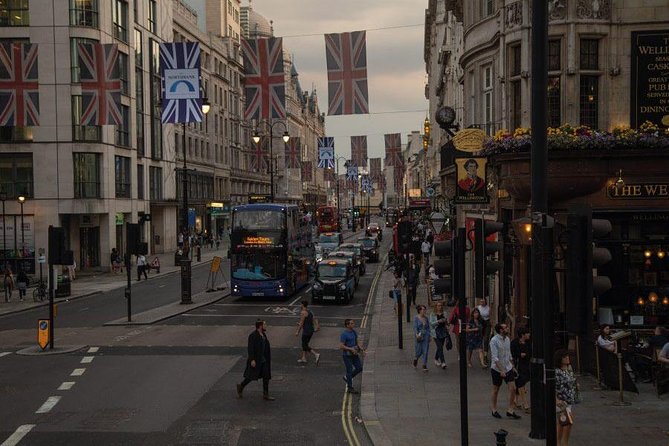 London by Night Sightseeing Open Top Bus Tour with Live Guide - Westminster Abbey and the Elizabeth Tower (Big Ben) glow