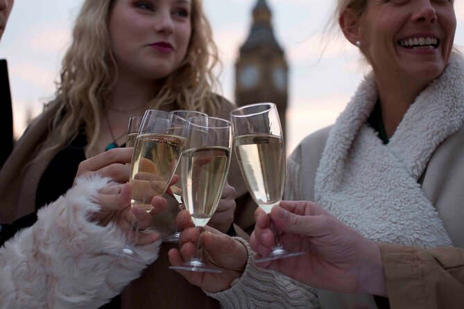 River Thames Evening Cruise with Sparkling wine and Canapés - HMS Belfast and Canary Wharf: old naval England meets modern London